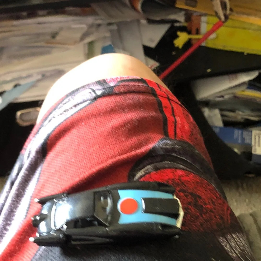 Black Toy Sports Car with Blue Hood and Red Dot